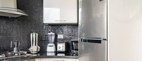 Coffee/tea maker, fridge, microwave, oven