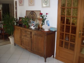 A wooden cabinet with drawers and a vase with flowers on top. - LOCQUINGHEM PALACE 3 Bed and Breakfast Rooms (Rety)