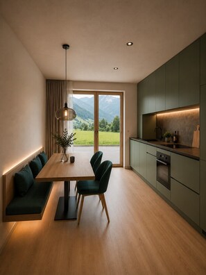 A modern kitchen with a dining area, wooden flooring, and a view of mountains through large windows. - The Hideaway: Arrive, unwind, and simply feel at home. (Kaltenbach)