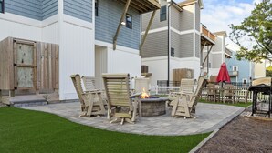 A patio area with outdoor furniture and a fire pit. - Ocean Views, Elevator, Fire Pit (Surf City)