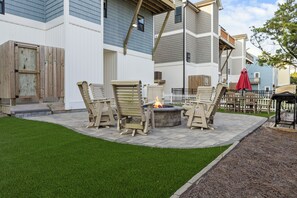 A patio area with outdoor furniture and a fire pit. - Ocean Views, Elevator, Fire Pit (Surf City)