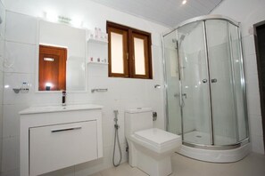 Shower, hair dryer, towels, soap