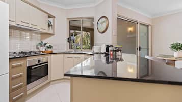 Coffee/tea maker, fridge, microwave, oven