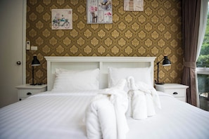 A neatly made bed with white linens and two bedside lamps. - A107 Cozy 2-bedroom apartment with Playground near Beach (Nongkae)