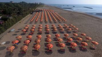Private beach, white sand, beach umbrellas, beach volleyball