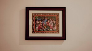 A framed artwork on a wall. - HOTEL DIBYANSH PREMIUM (Bhubaneshwar)