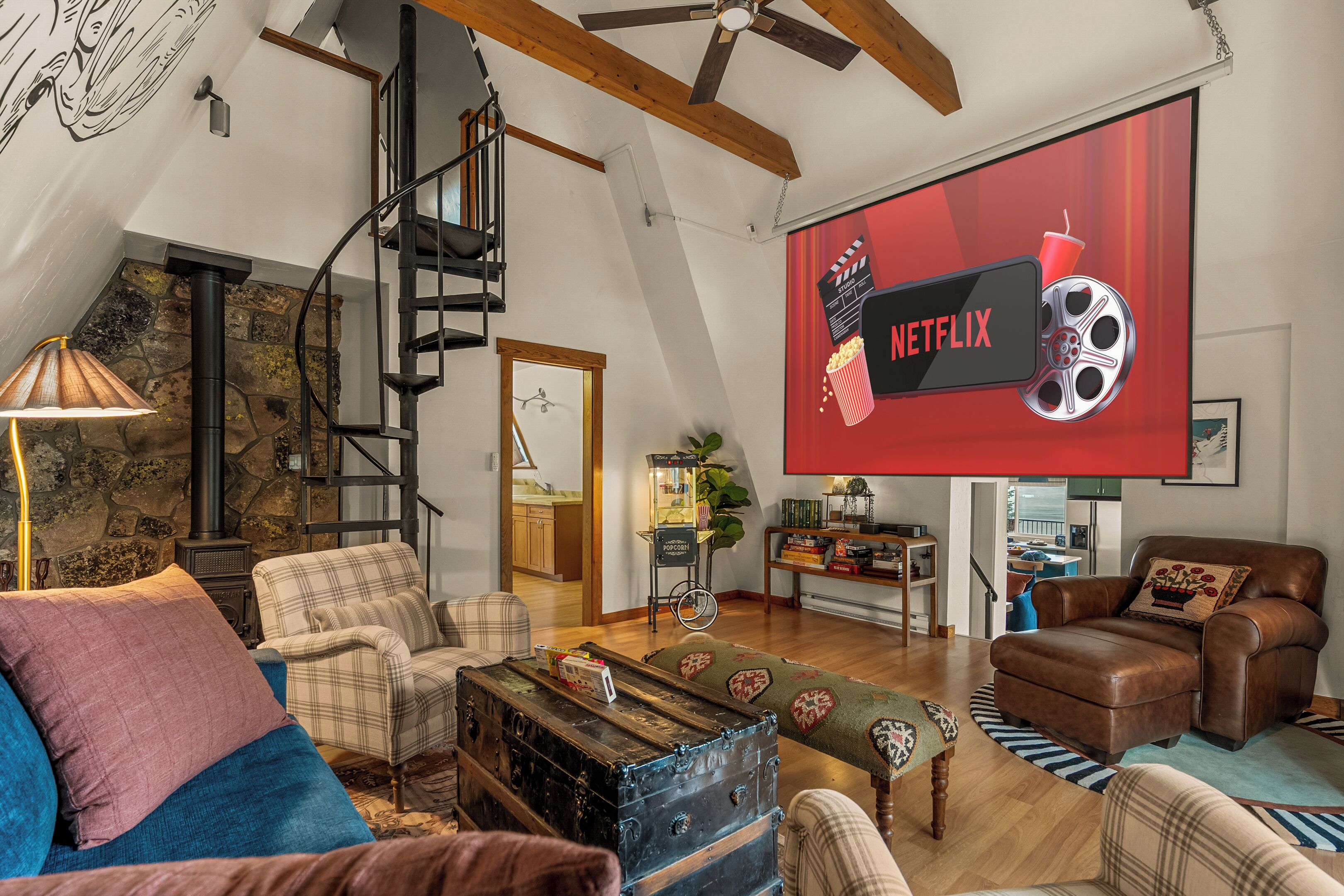 A spacious living room with a high ceiling, a staircase, and a large flat-screen TV displaying the Netflix logo.