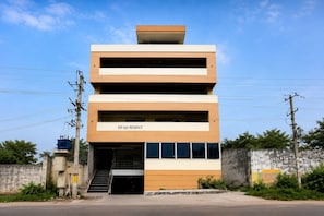 A multi-story building with a sign reading 'SRI SAI REGENCY.' - Classic IT Hub Khammam (Khammam)
