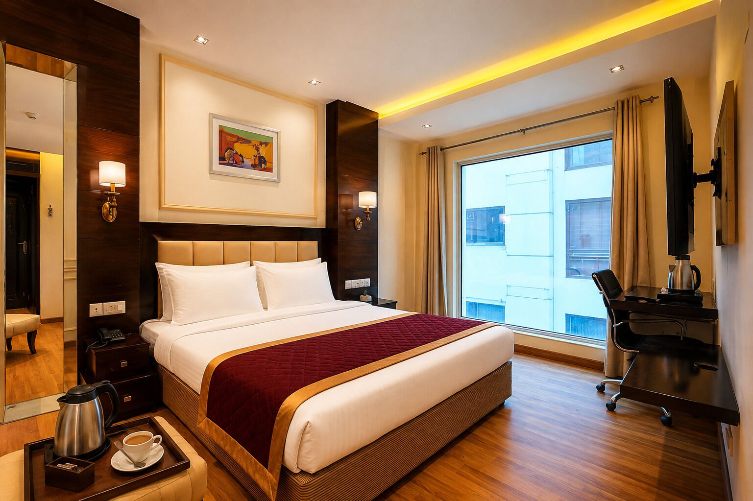 A hotel room with a large bed, a desk with a chair, a coffee maker, and a TV.