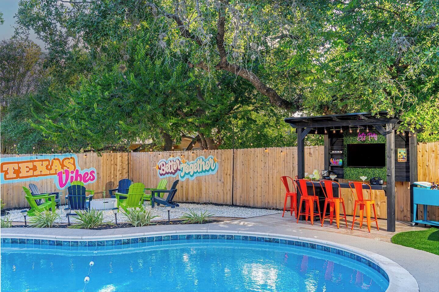 Private pool oasis with shaded lounge seating and a fun outdoor bar