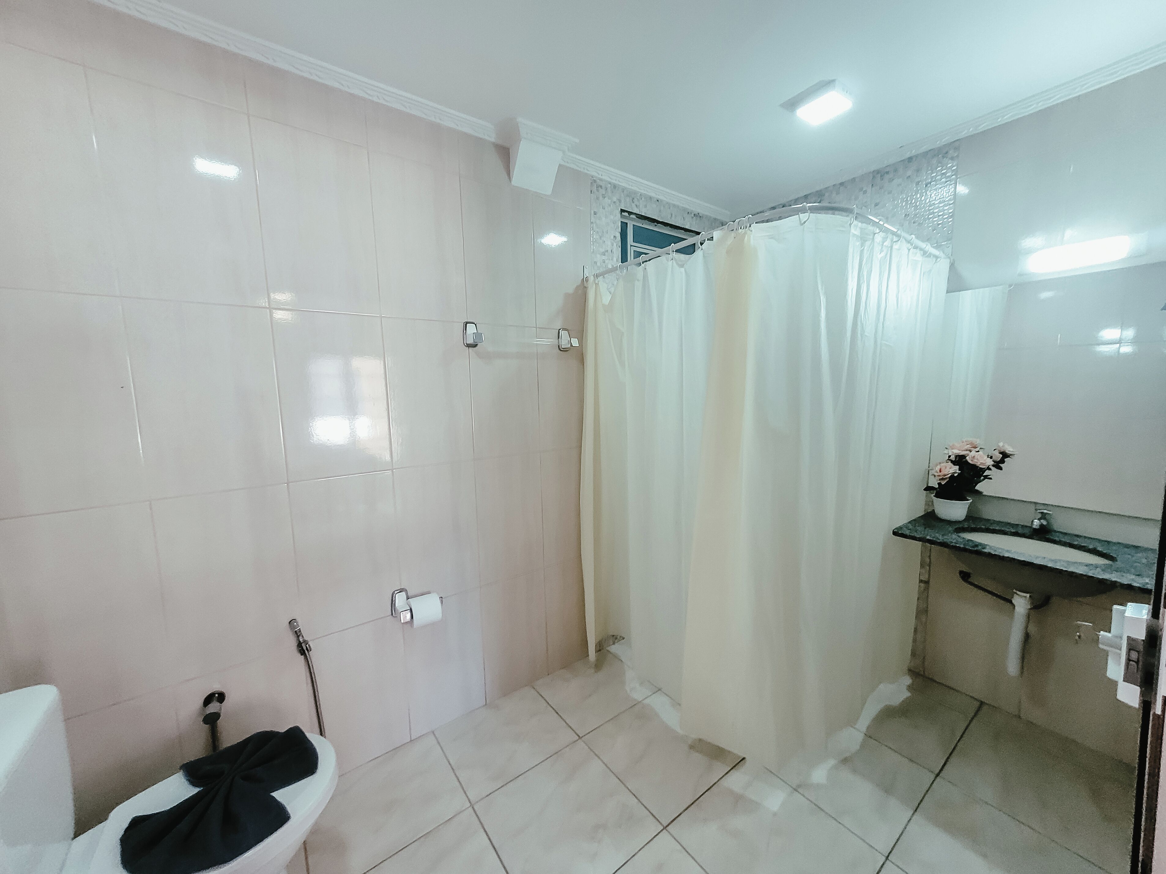 Economy Quadruple Room | Bathroom | Shower, towels, soap, shampoo