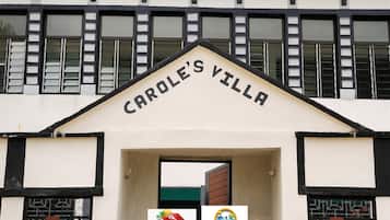 The entrance to Carole's Villa with a sign above the doorway.