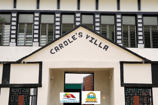 The entrance to Carole's Villa with a sign above the doorway.