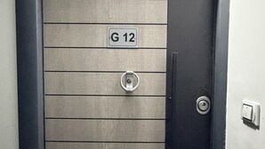 A door with a metal plate labeled 'G 12' and a keyhole. - Lavonda Beach resort hurghada (Hurghada)