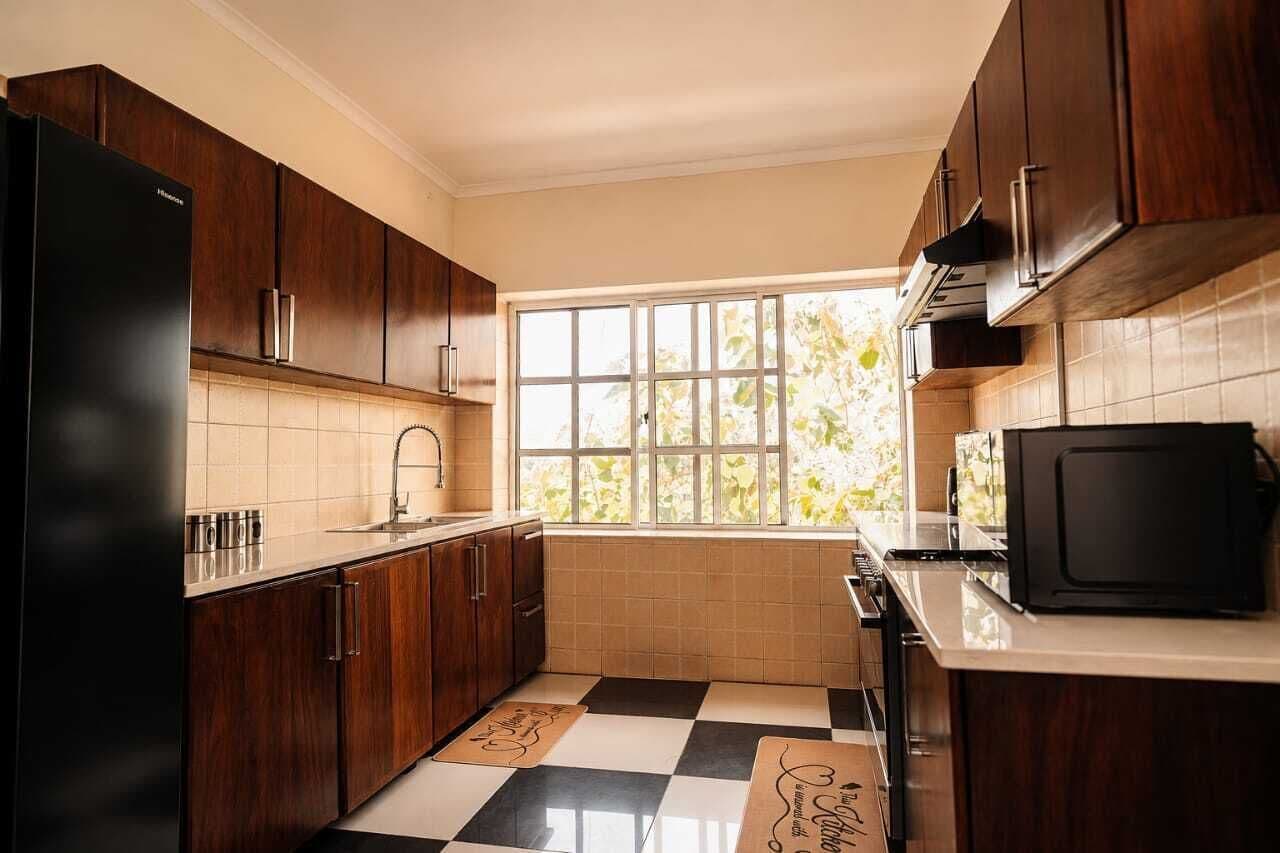 Comfort Apartment, 2 Bedrooms | Private kitchen | Full-size fridge, microwave, oven, stovetop