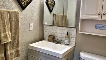 Hair dryer, towels, soap, shampoo