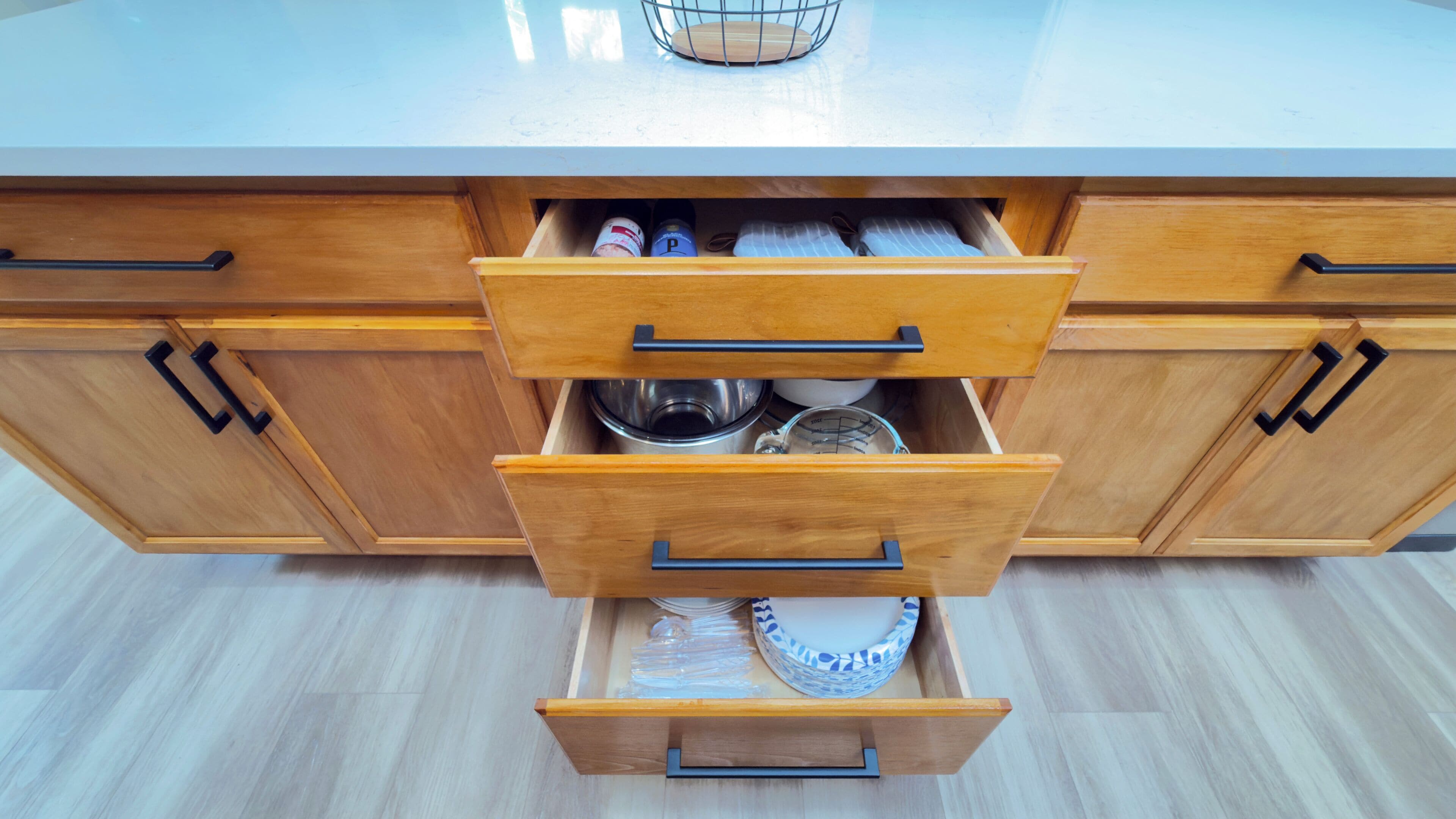 A kitchen with wooden cabinets and a countertop.