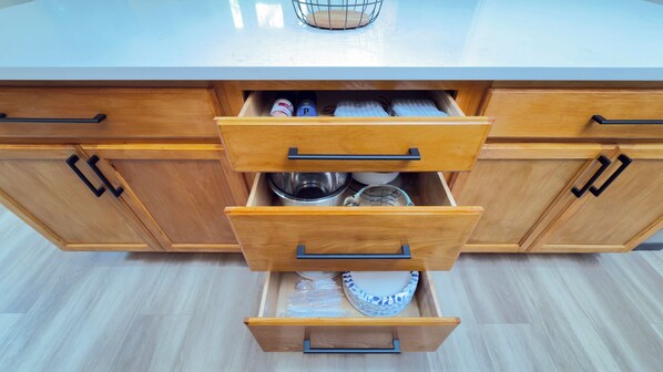 A kitchen with wooden cabinets and a countertop.