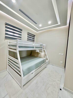A bunk bed with a mattress and pillows, a ceiling vent, and a wall-mounted light fixture. - Esmeralda Beach Resort 3 Bedrooms Condo D 902 (Puerto Peñasco)