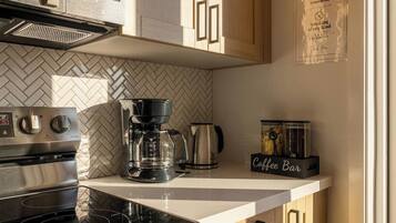 Coffee/tea maker, fridge, microwave, oven