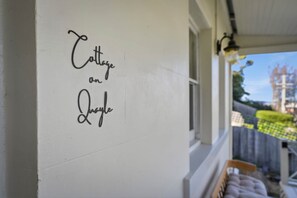 A wall with the text 'Cottage on Lake' written in cursive. - Cottage on Quayle - 3 Bedroom in Sandy Bay (Sandy Bay)