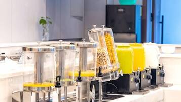 A breakfast bar with multiple dispensers for different food items.