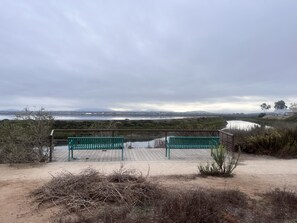 A wooden viewing platform with benches overlooking a body of water and distant hills. - Charming 2-bedroom townhome in Imperial Beach, close to Coronado (Imperial Beach)