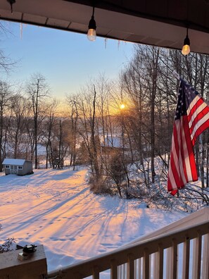 A snowy landscape with a house and an American flag. - Welcome to Sherwood Forest in the heart of Ohio! (Newark)