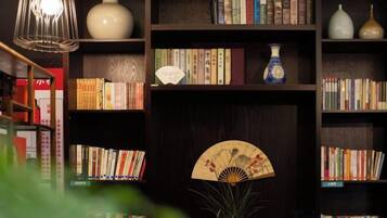 A bookshelf with books and decorative items.