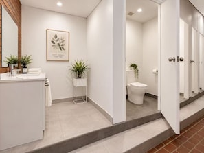 A modern bathroom with a sink, mirror, and toilet. There is a framed quote on the wall and a potted plant on the floor. - Cozy Private Room in the Heart of Marrickville (Marrickville)