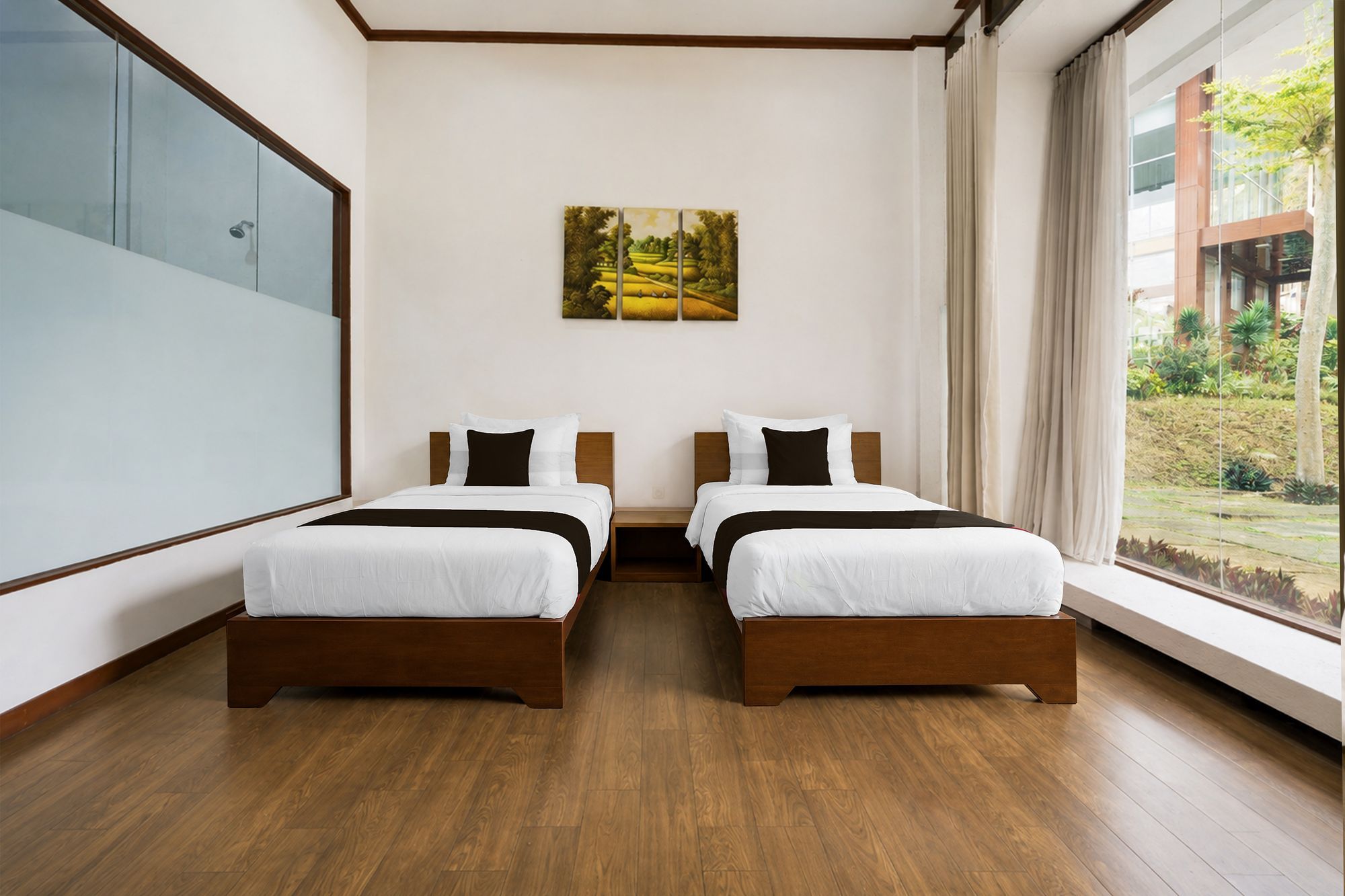 A hotel room with two beds, a large window, and a painting on the wall.