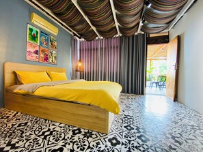 A room with a bed, patterned floor, and a view to an outdoor area. - 3BR Old Quarter Stay | Walk to Lake & Beer Street | Rooftop & Soaking Tub (Hà Nội)
