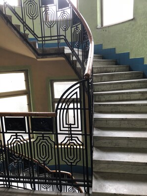 A staircase with ornate metal railings and a handrail. - Fabulous 1-bedroom studio with AC in vibrant Budapest (Budapest)