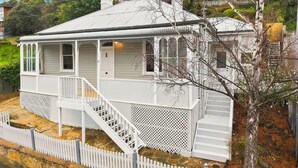 A single-story house with a porch, a staircase, and a fenced yard. - Sandy Bay Style | Close to CBD (Sandy Bay)