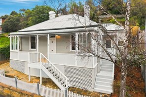 A single-story house with a porch, a staircase, and a fenced yard. - Sandy Bay Style | Close to CBD (Sandy Bay)