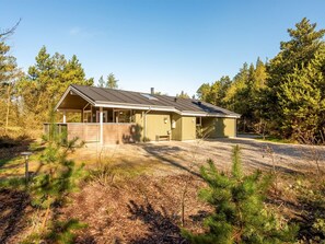 A single-story house with a sloped roof, a covered porch, and a fenced yard. - "Liina" - 3km from the sea by Interhome (Rømø)