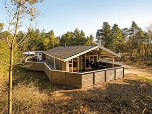 A wooden cabin with a covered porch and a small attached structure. - "Liina" - 3km from the sea by Interhome (Rømø)