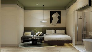 Un dormitorio moderno con una cama, mesitas de noche, una lámpara colgante y una zona de ducha.