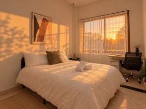 A bedroom with a bed, a desk, and a chair. - Marrickville Road Private Room (Marrickville)