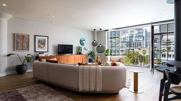 Apartamento Deluxe, vistas a la ciudad | Zona de estar