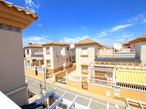 A residential area with multiple buildings, balconies, and a clear sky. - Cozy 3-bedroom house in Villamartin, Orihuela Costa (Orihuela Costa, Alicante)