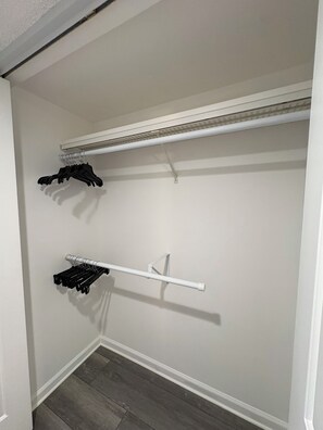 A closet with a white ceiling, a white door, and a grey floor. - TOP-FLOOR WATERFRONT CONDO GETAWAY (Punta Gorda)