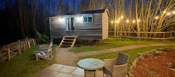 Luxury Waterside Shepherd’s Hut | Private Garden, Log Burner & Woodland Escape