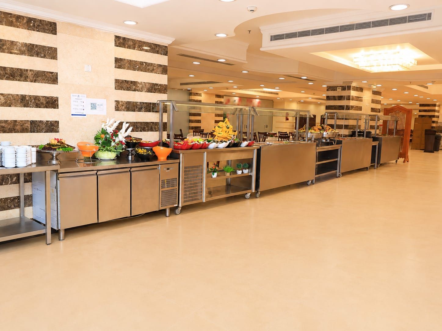 A buffet area with a variety of food items and a clean, modern design.