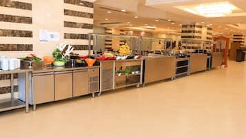 A buffet area with a variety of food items and a clean, modern design.