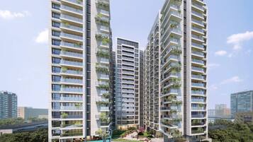 A high-rise residential building with multiple balconies, a rooftop garden, and a pool area.