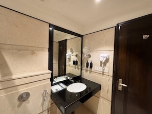 A modern bathroom with a large mirror, two sinks, a hairdryer, and a towel rack. - asar Safdarjung By Orion Hotels (New Delhi)