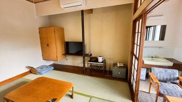 Down comforters, desk, WiFi (free), bed sheets