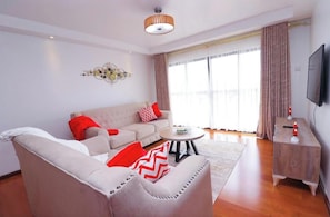Deluxe Apartment, Balcony, City View | Living area | 32-inch Smart TV with digital channels - The Alma by Cytonn Ruaka (Ruaka)