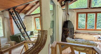 A unique rustic cottage in the woods with a stream—pure nature